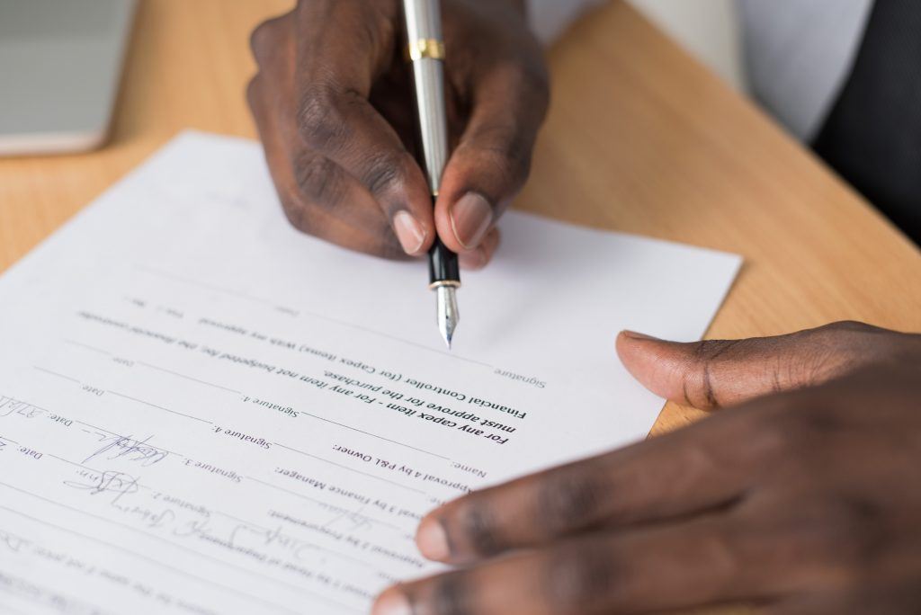 Close-up of Person Writing on White Paper