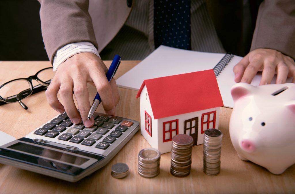 Businessman with money and calculator.