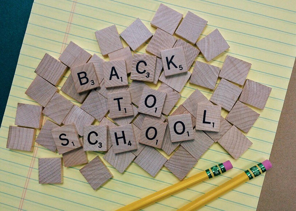 Brown Scrabble Tiles on Yellow Paper Back to School